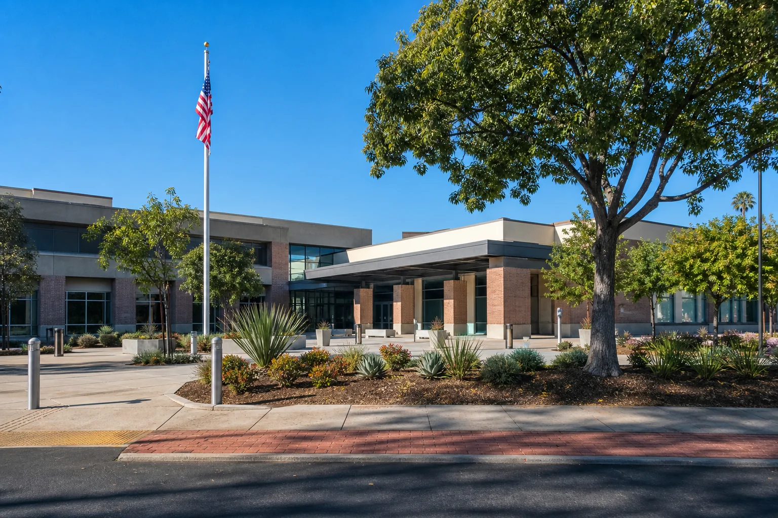Contemporary brick municipal building and landscaped entry representing Bellflower City Hall