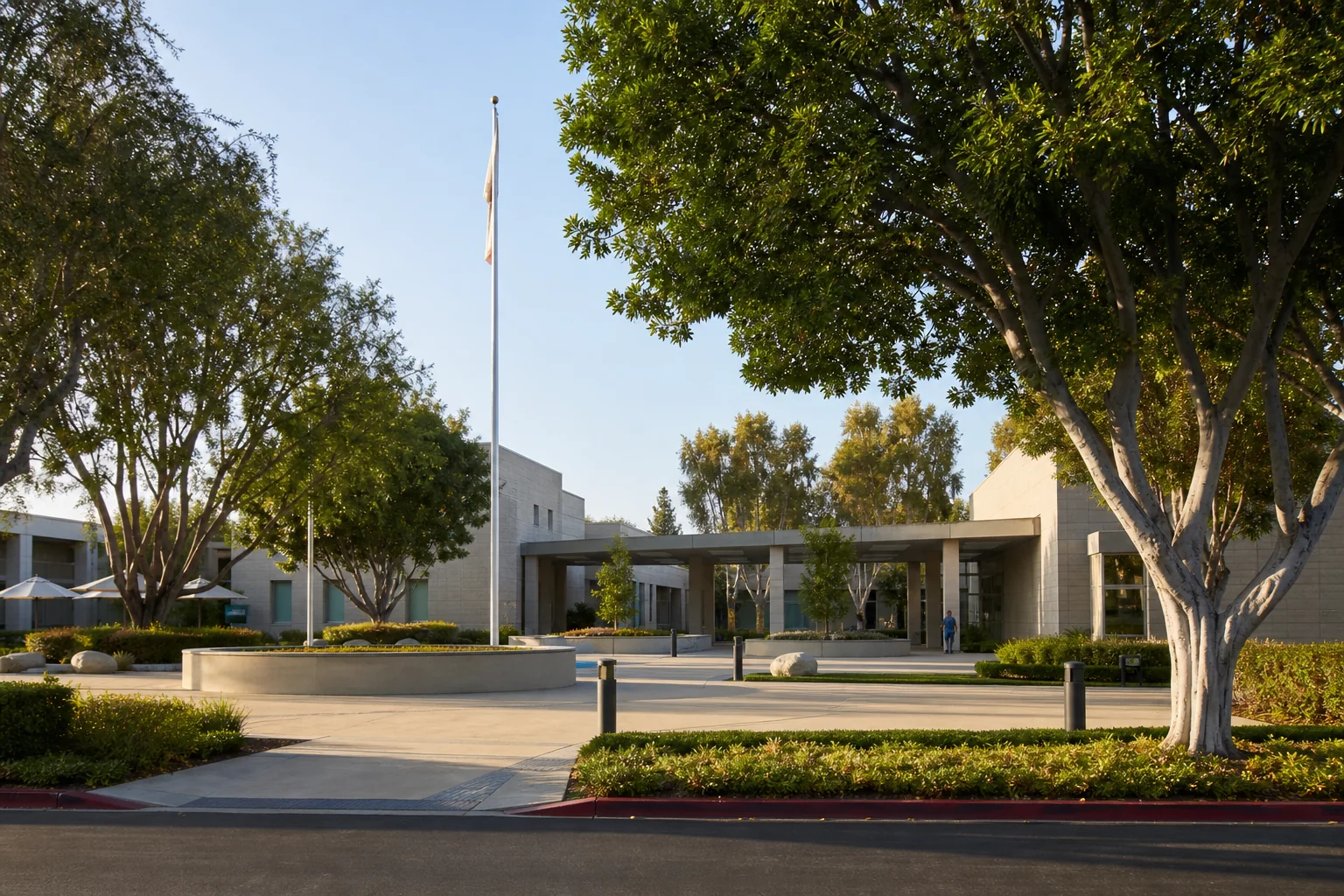 Modern municipal buildings and shaded public plaza representing Cypress Civic Center