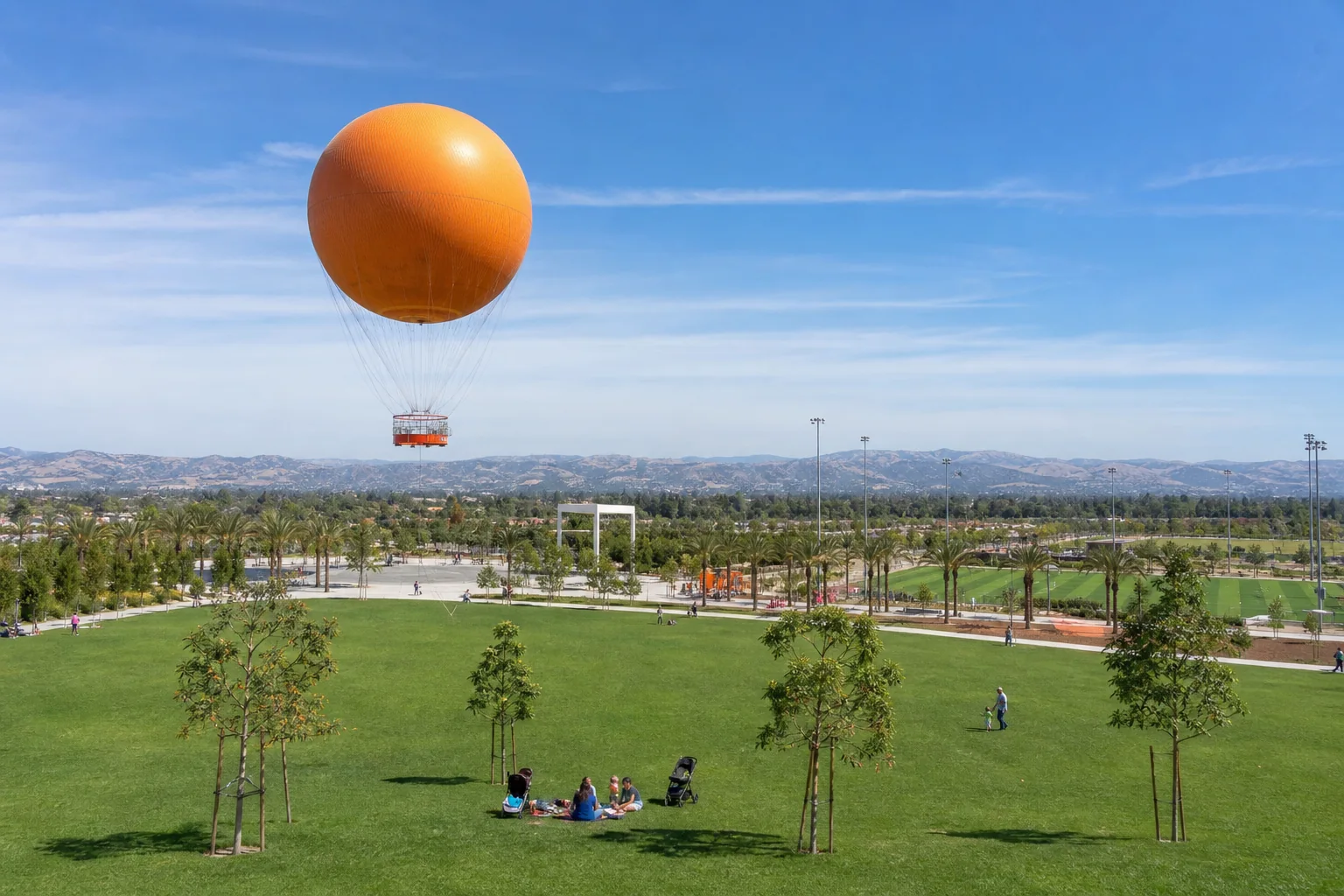 Iconic orange balloon above lawns and sports fields representing Great Park in Irvine