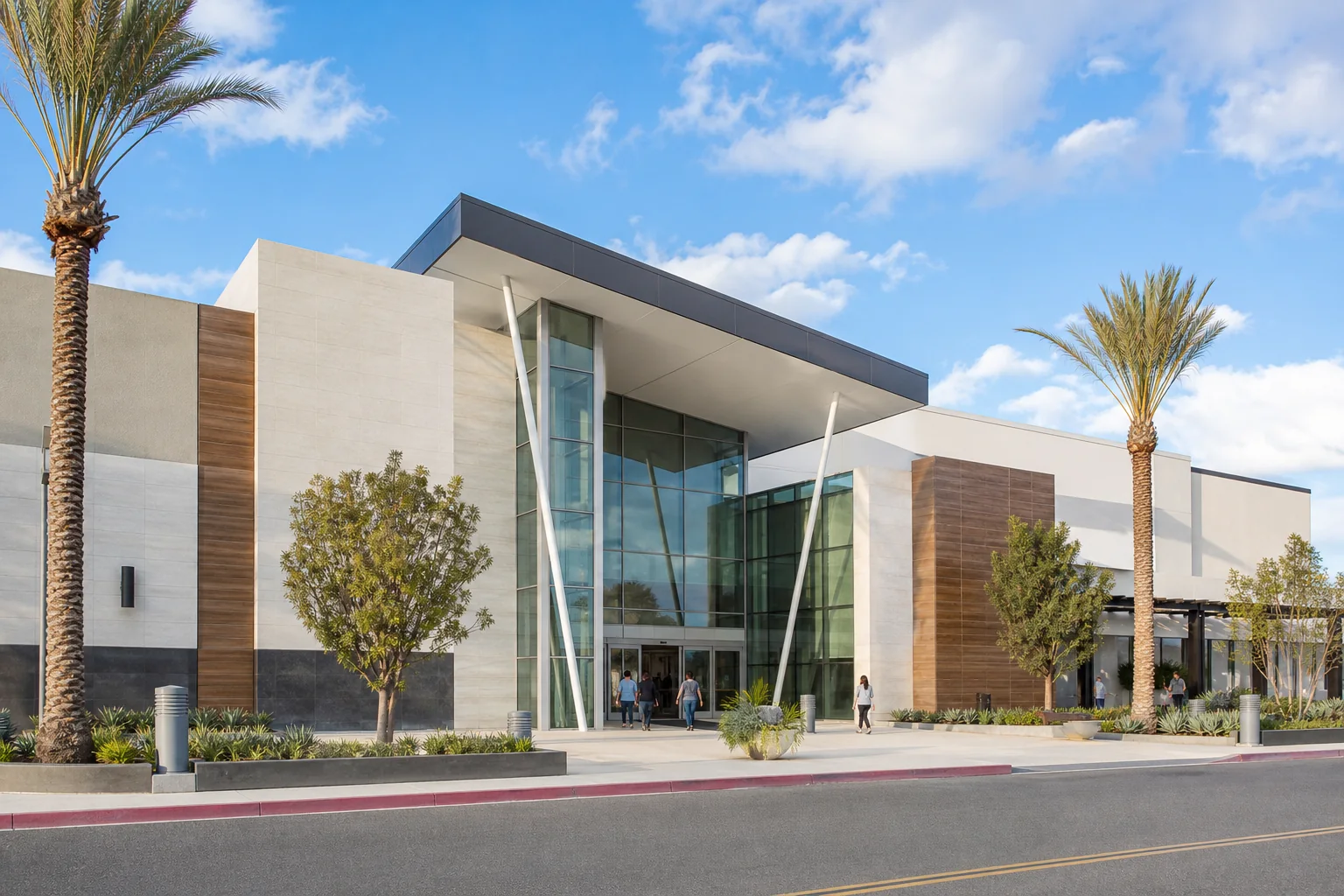 Contemporary glass shopping-center entrance and palms representing Montclair Place