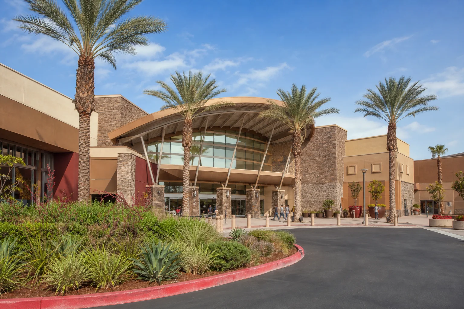 Large shopping center entrance and desert-toned landscaping representing Ontario Mills