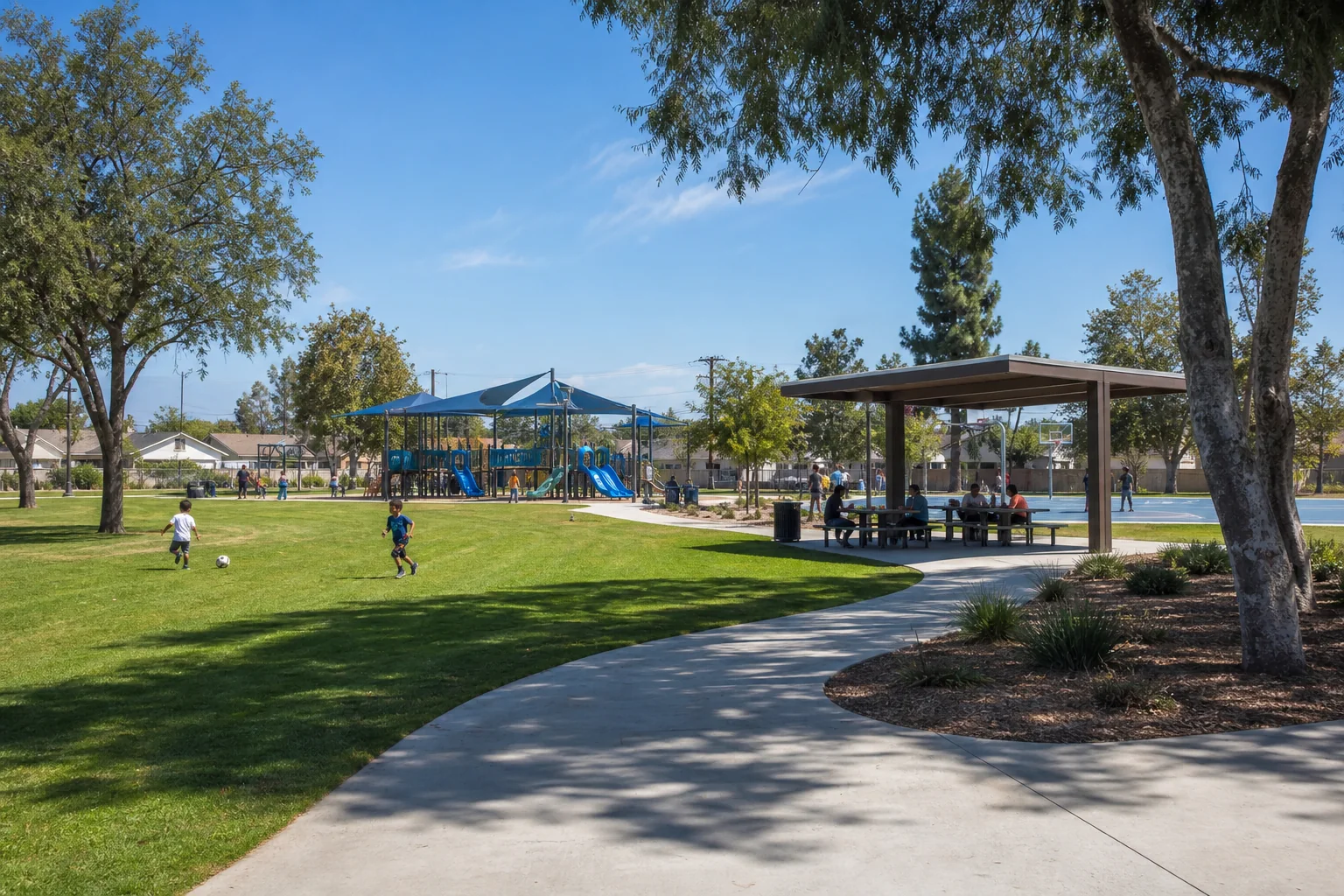 Community lawn, shaded playground, and basketball court representing Progress Park in Paramount