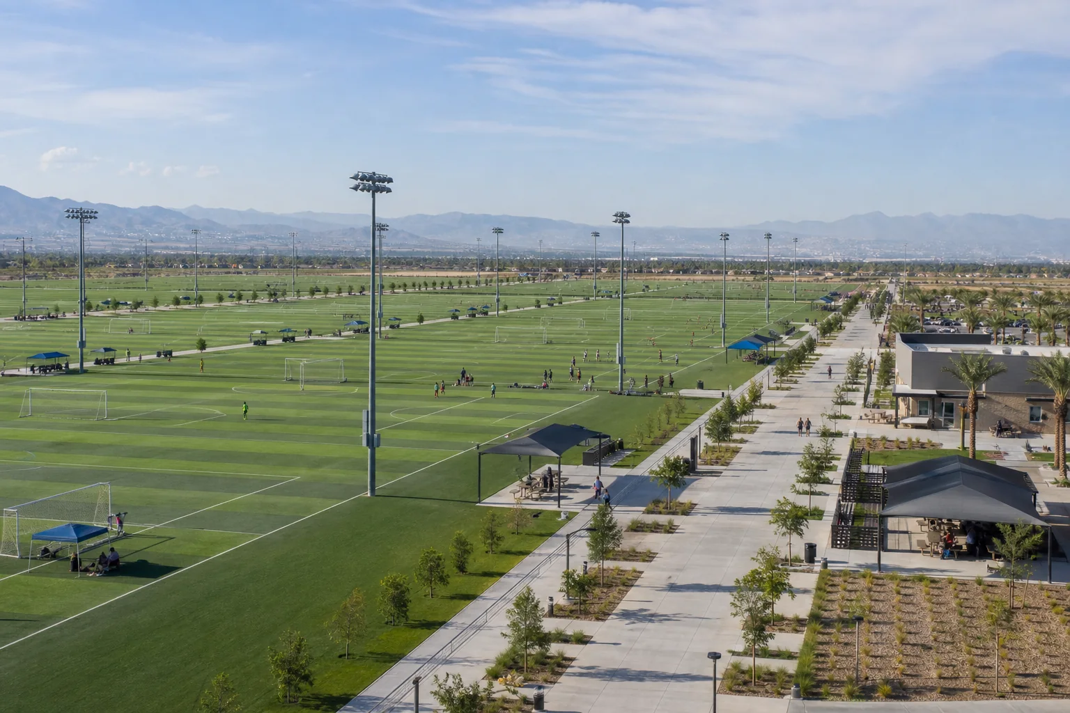 Expansive soccer fields and event promenade representing SilverLakes Sports Complex