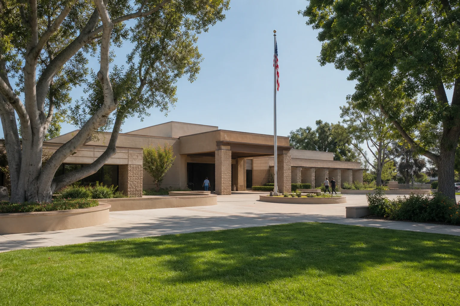 Low-rise municipal building and landscaped plaza representing Stanton City Hall
