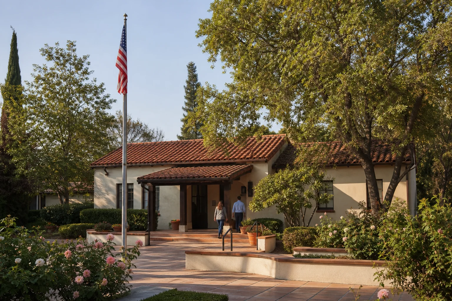 Small Spanish-style municipal building and garden representing Villa Park City Hall