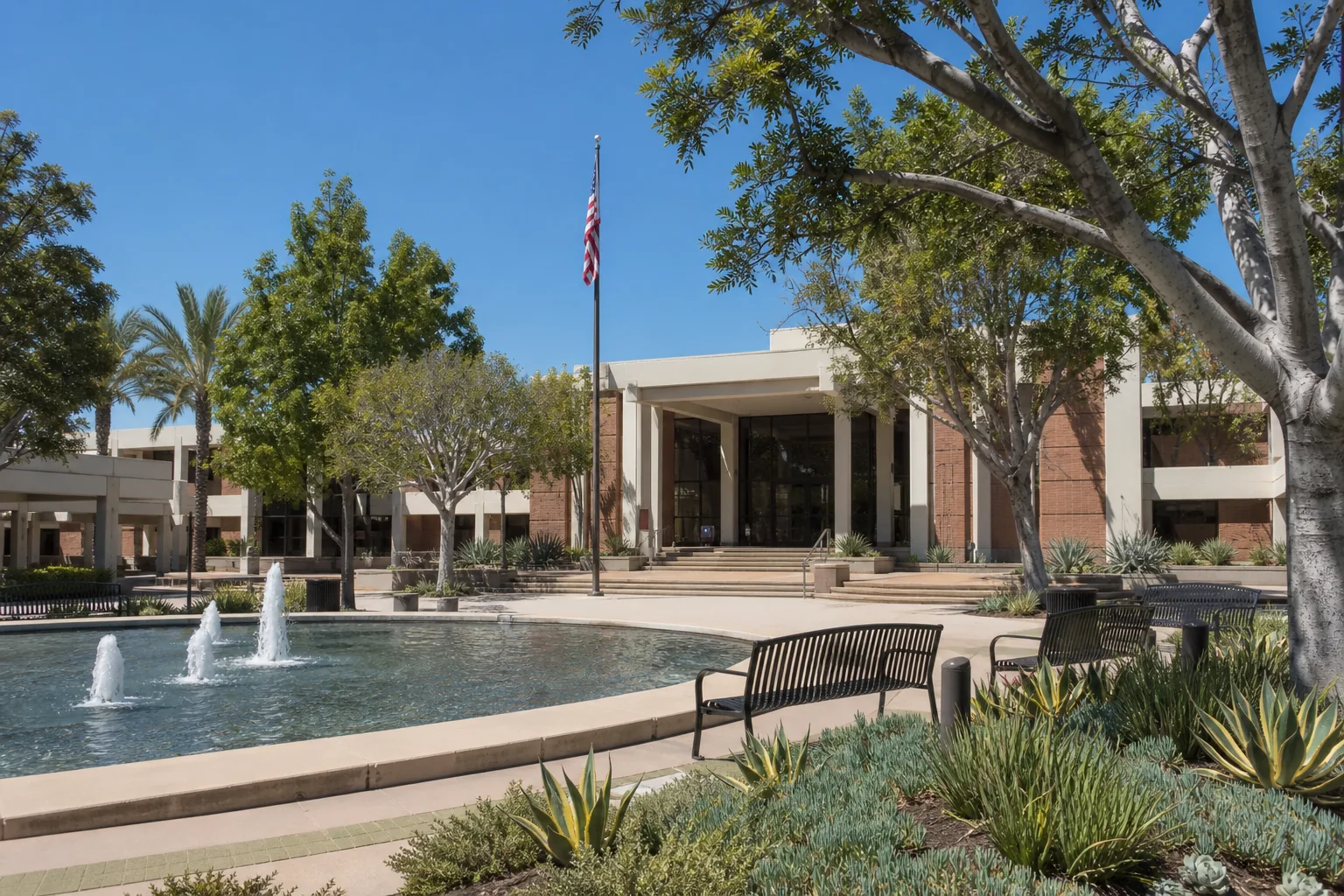 Municipal building, fountain, and landscaped plaza representing Westminster Civic Center