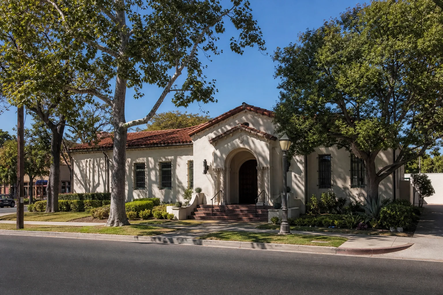 Spanish Colonial Revival museum building and shaded forecourt representing Whittier Museum