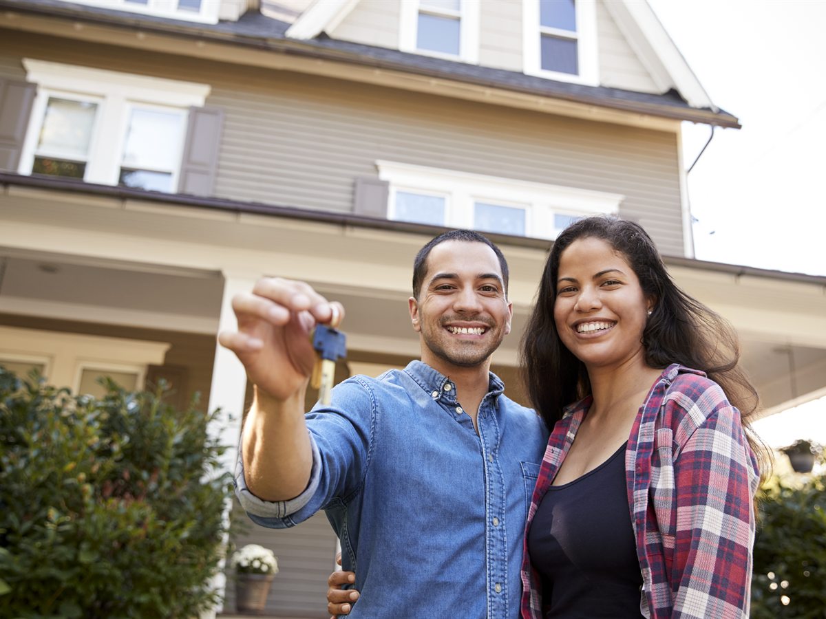 Real estate investors holding house keys and using a virtual office address