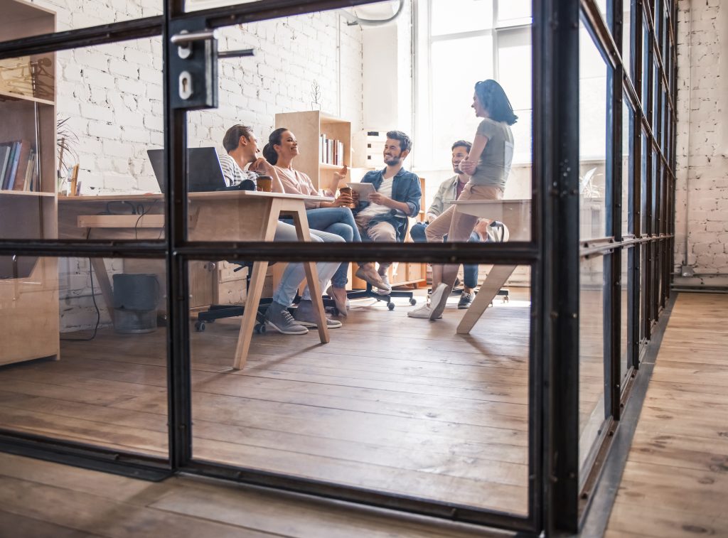 Business team collaborating in a modern private office workspace