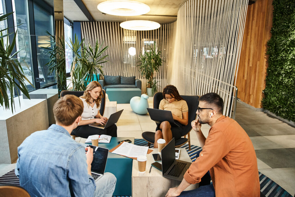 Coworkers working together in a relaxed creative office