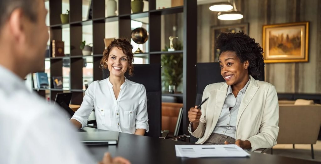 Candidate meeting with two interviewers in a professional meeting room