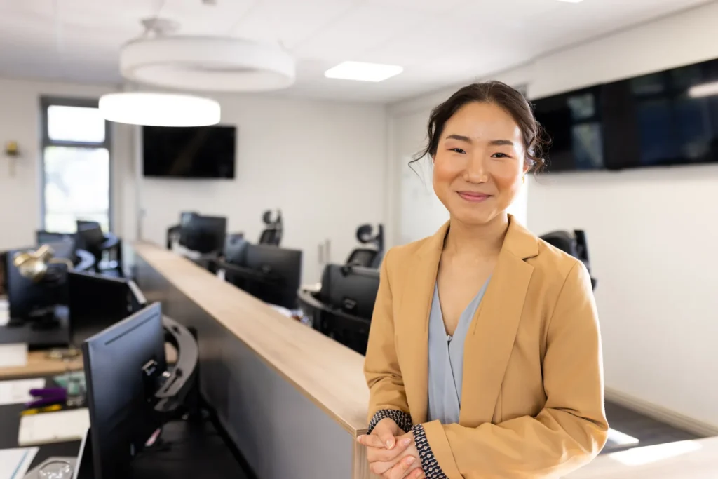 Business professional at an office reception for a registered-agent notice workflow.